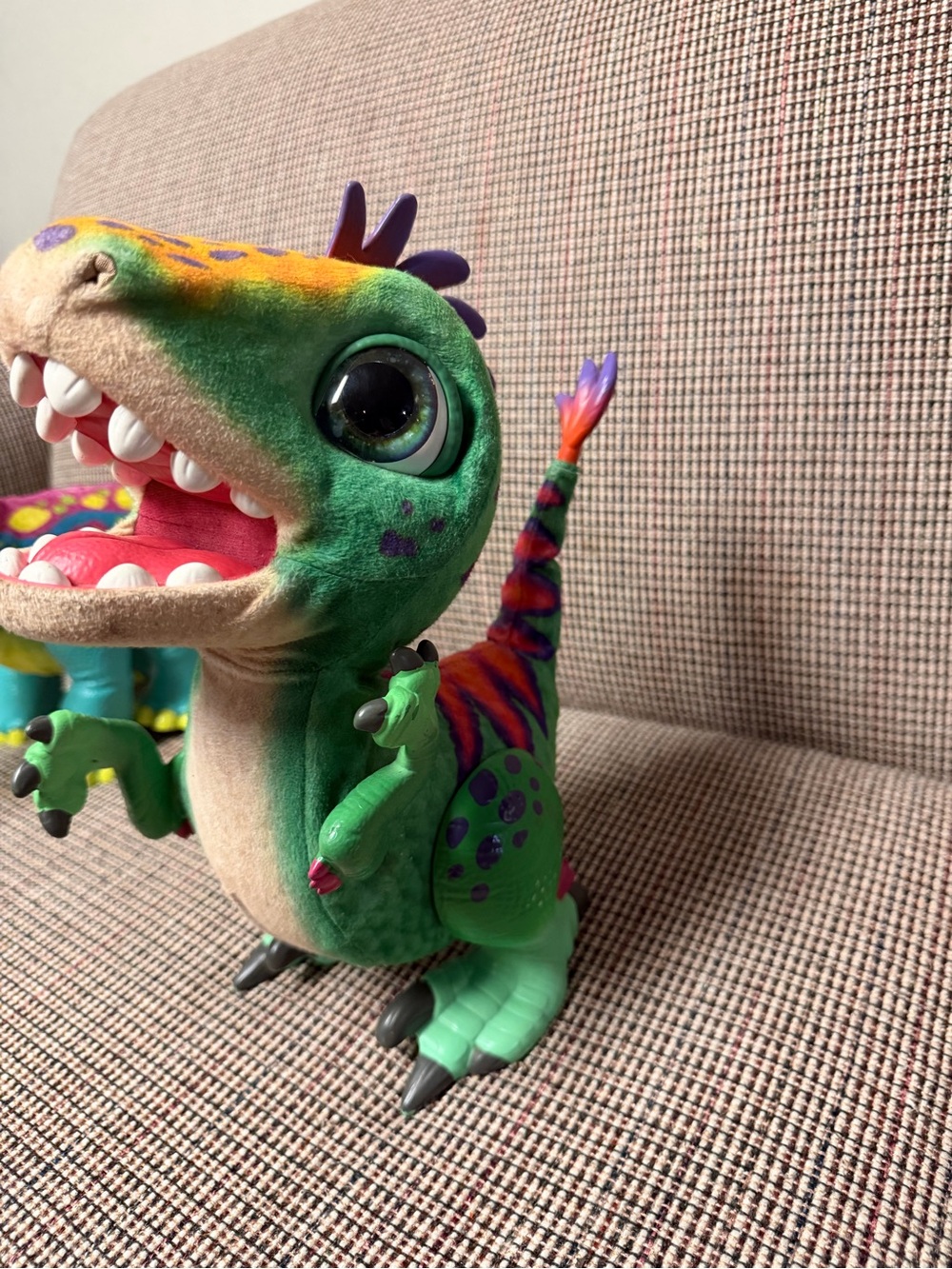 Interactive Green Dinosaur Toy with Multi-Color Accents